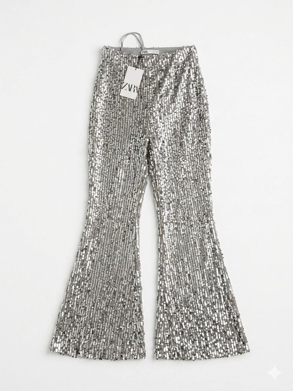 Silver Sequin Flared pants. L. Never worn with tags